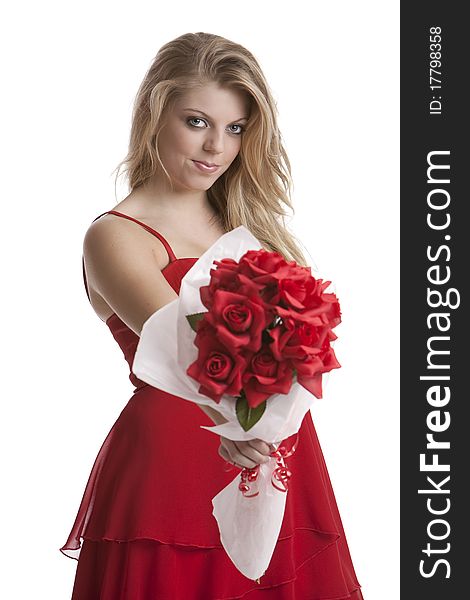 Beautiful teenage girl in a red dress holding a bouquet of roses isolated on white background