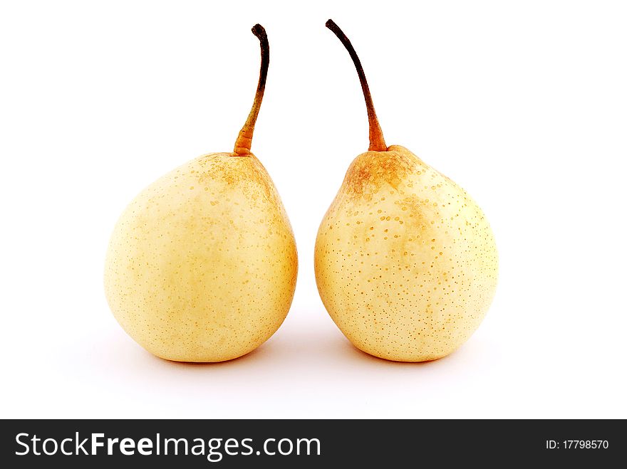 Two yellow pears with shadow isolated on white background