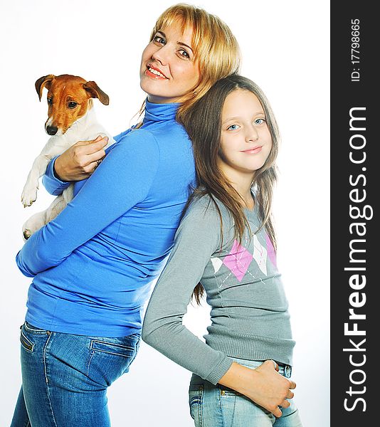 Young mother and her daughter with Jack Russell Terrier. over white background. Young mother and her daughter with Jack Russell Terrier. over white background