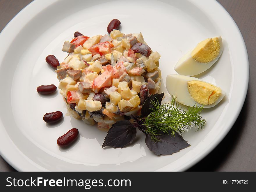 Salad with fresh and boiled vegetables with mayonnaise