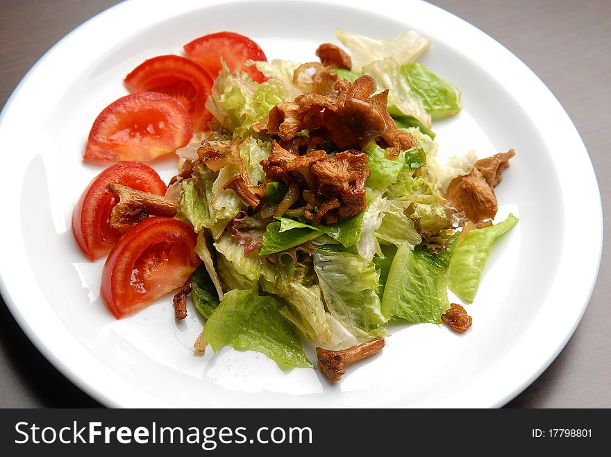 Salad with cabbage, fresh vegetables and mushrooms