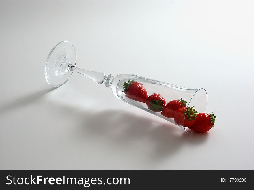 Strawberries Spilled From Wineglass