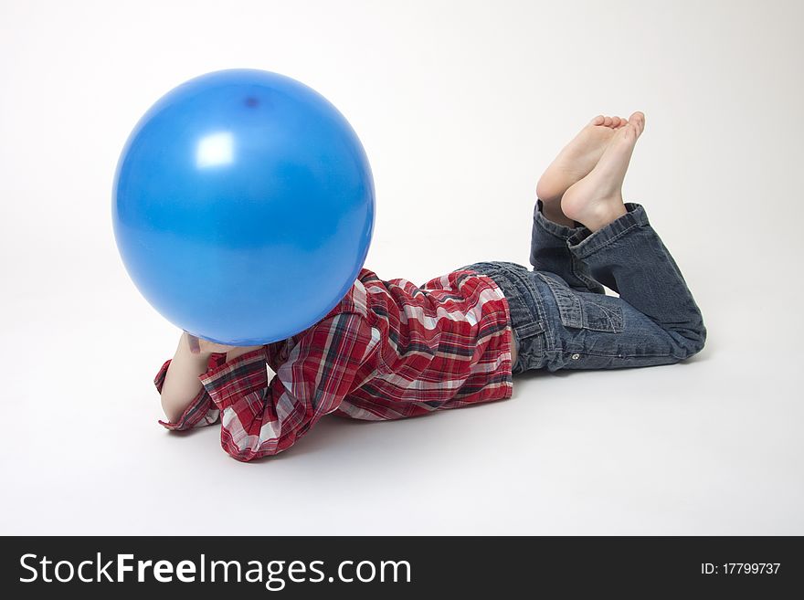 Portrait Of Cute Boy With Blue Balloons