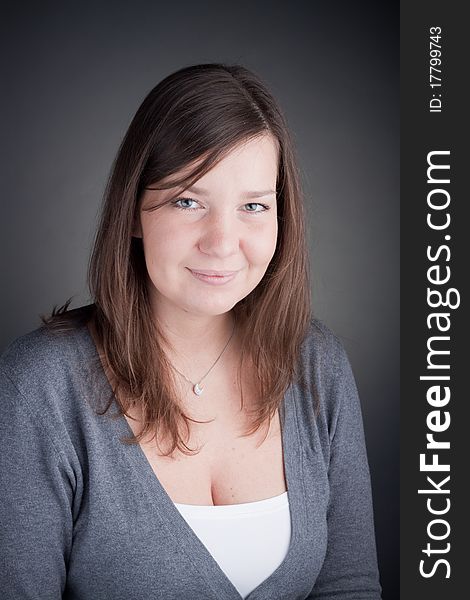 Beautiful smiling woman, with grey background