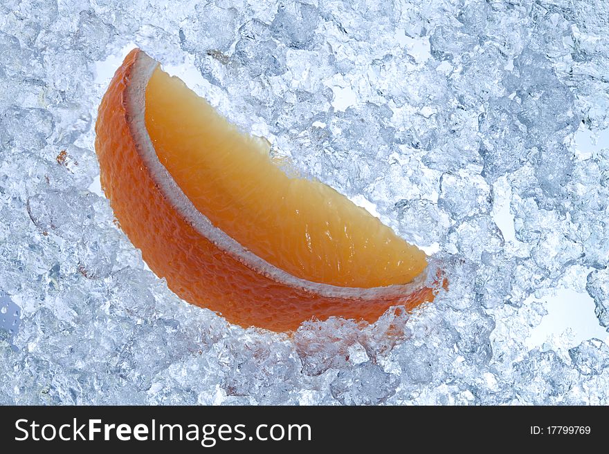 Orange slice in ice shards