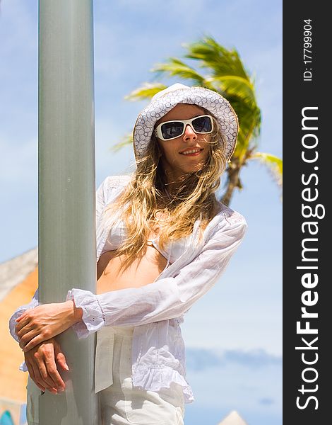 Lady on white yacht at a tropical coast. Lady on white yacht at a tropical coast