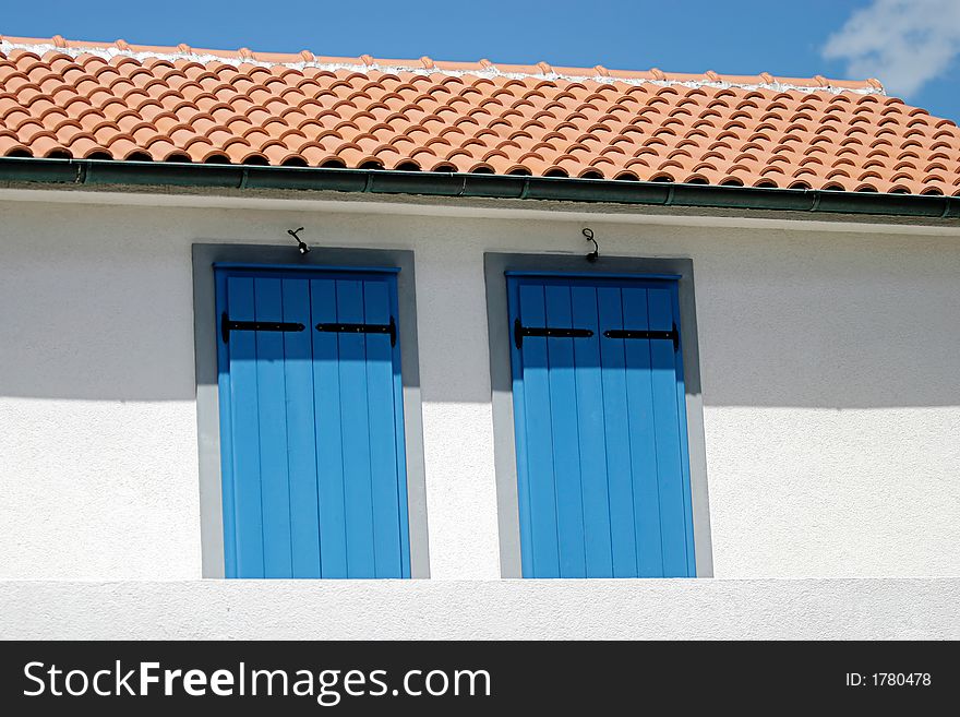 A house with Two Blue doors in the mediterranean