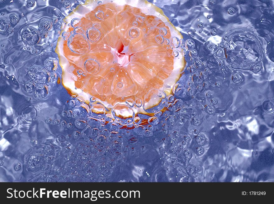 Orange splashing water