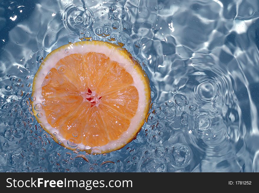 Orange splashing water