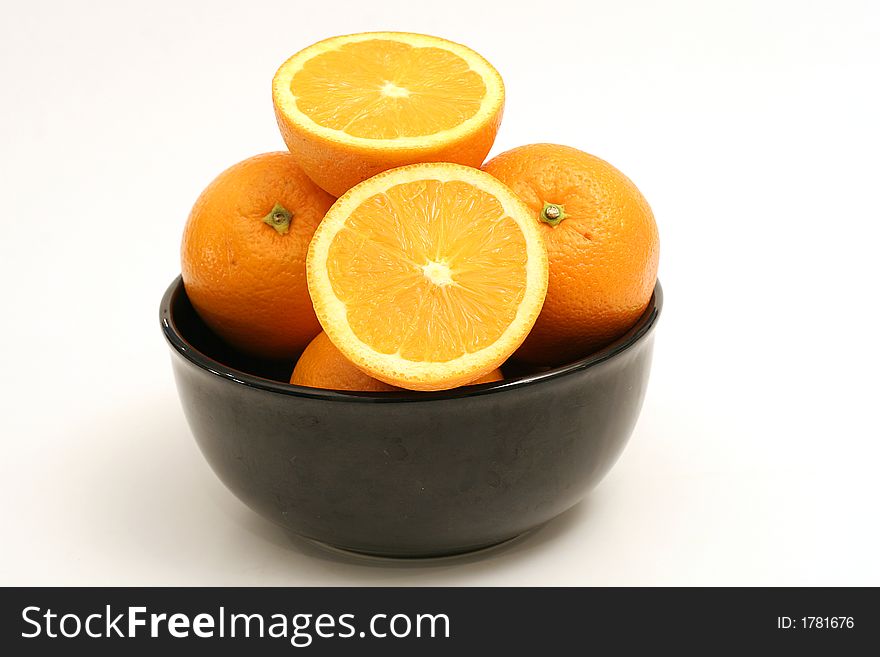 Shot of a bowl of oranges on white