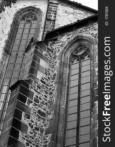 A black and white image of a cathedral wall. A black and white image of a cathedral wall