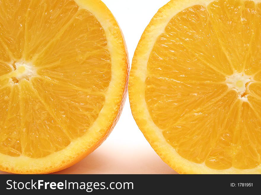 Shot of two orange halfs upclose. Shot of two orange halfs upclose