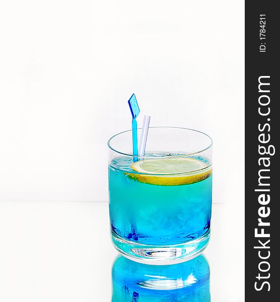 Fresh blue drink with lemon and ice