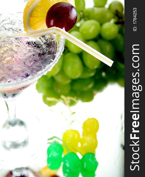 Violet drink with fruits and colt of ice