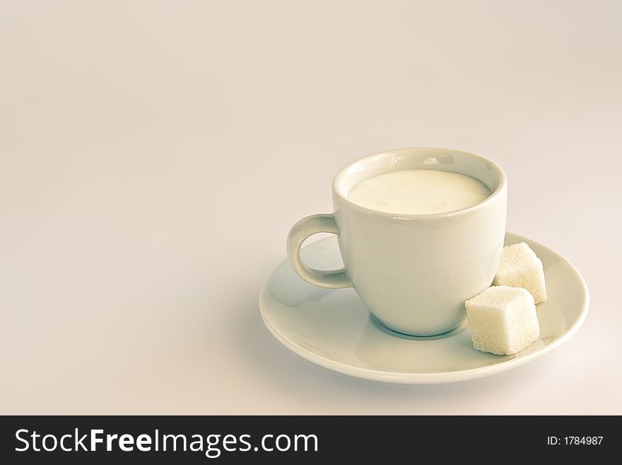 Sour-milk yoghurt with slices of sugar in a white cup