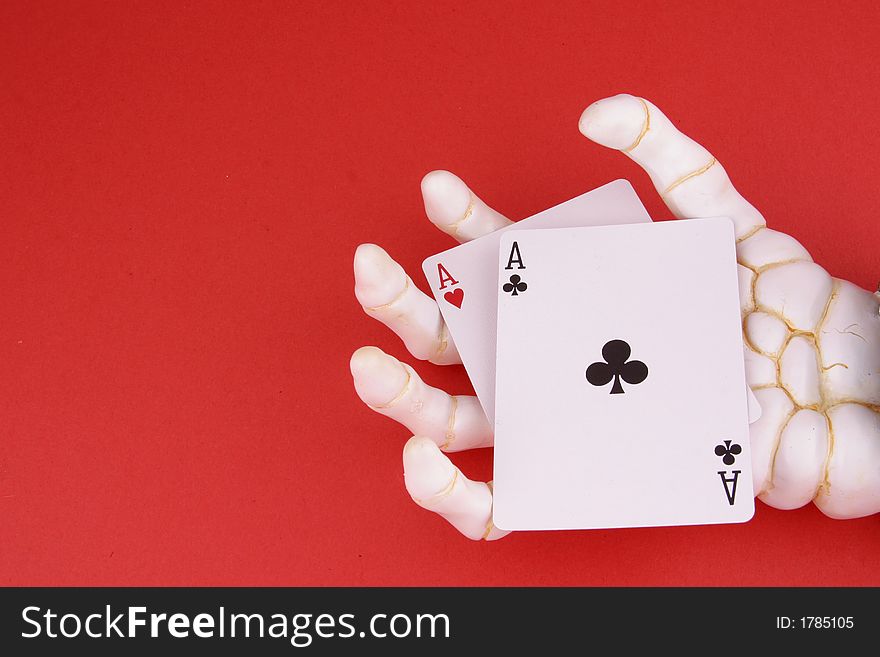 Pair of Aces in the hand of Death with text space on left side of image. Pair of Aces in the hand of Death with text space on left side of image.