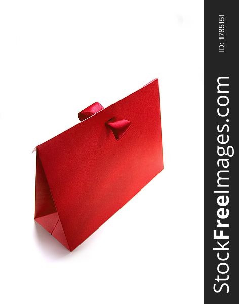 Red present box made of rough card cardboard.
