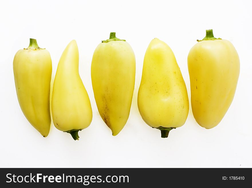 Group of yellow bellpeppers  over  white