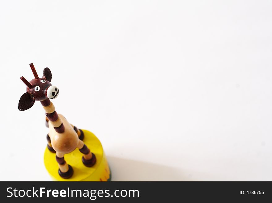 Picture of a wooden push puppet of a giraffe. Picture of a wooden push puppet of a giraffe