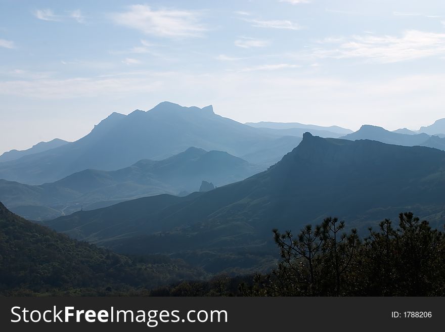 Mountainous country in the light blue haze