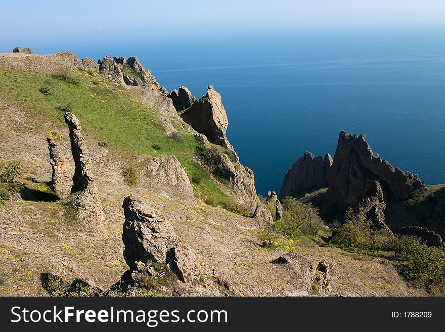 Chain of mountains on the blue sea in spring. Chain of mountains on the blue sea in spring