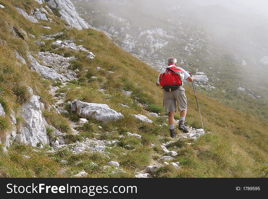 Older Man Walking Uphill