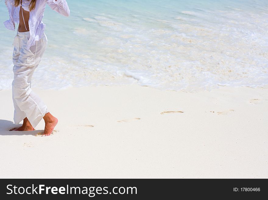 A young woman goes on a coastline