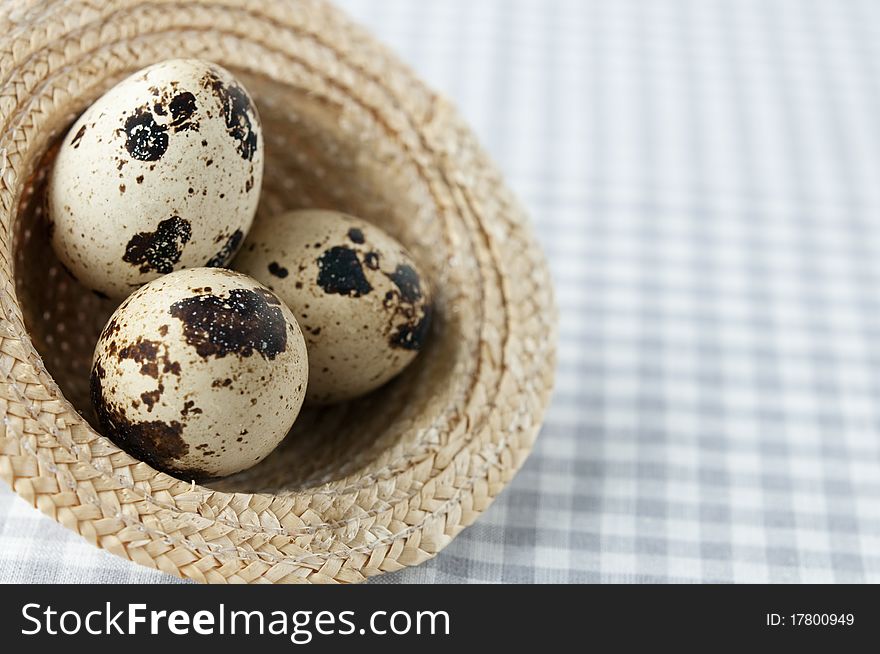 Quail eggs in a decorative wicker hat