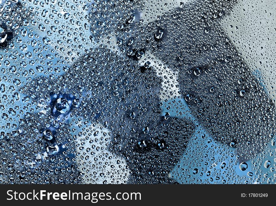 Pattern refracted in drops of water ideal as a background. Pattern refracted in drops of water ideal as a background.