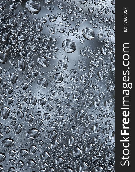 Pattern refracted in drops of water ideal as a background. Pattern refracted in drops of water ideal as a background.