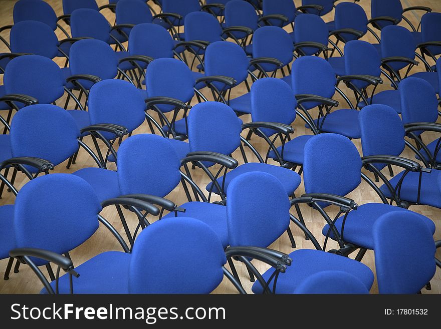 Blue seats on ballroom. Plastic chairs