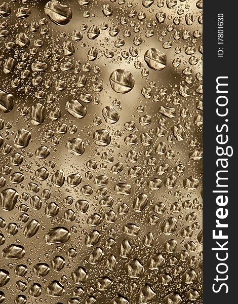 Pattern refracted in drops of water ideal as a background. Pattern refracted in drops of water ideal as a background.