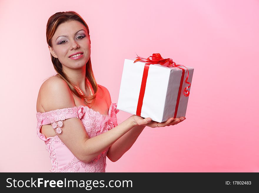 Happy girl with gift box over white