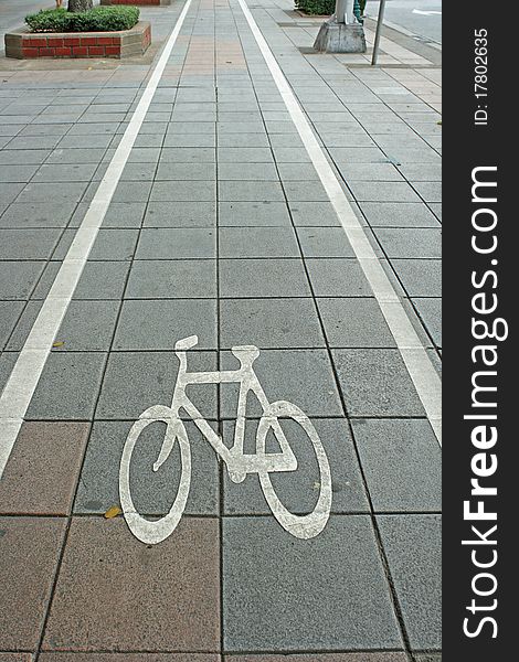 Bicycle lane symbol on road