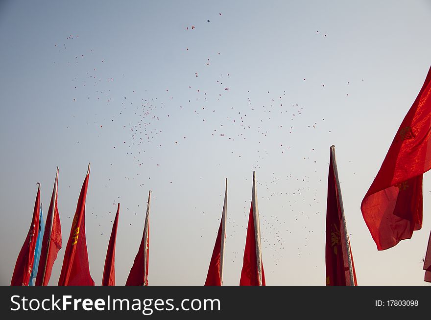 Balloons and flags, blue sky