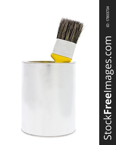 Paint can with yellow brush