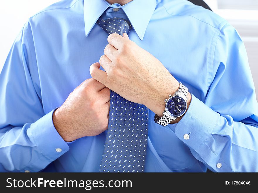 Mature businessman with blue shirt and tie