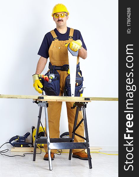 Mature contractor working. Over white background