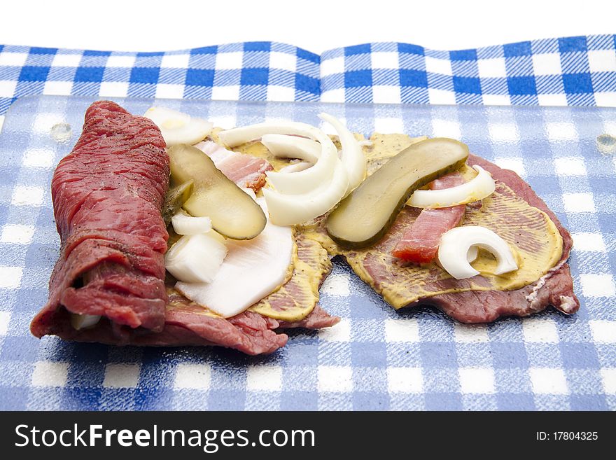 Raw roulade with filling on glass sheet