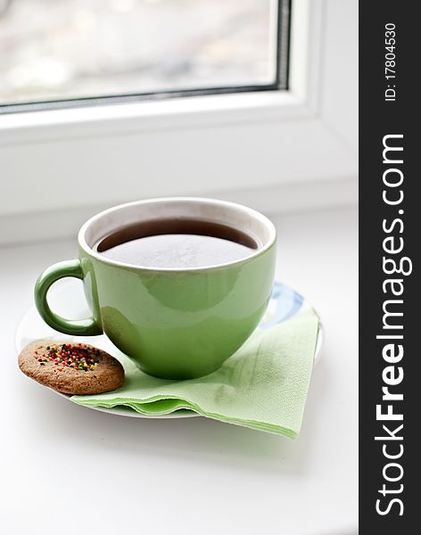 A cup of fragrant Ceylon tea with biscuits. A cup of fragrant Ceylon tea with biscuits