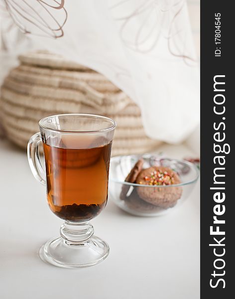 A cup of fragrant Ceylon tea with biscuits. A cup of fragrant Ceylon tea with biscuits