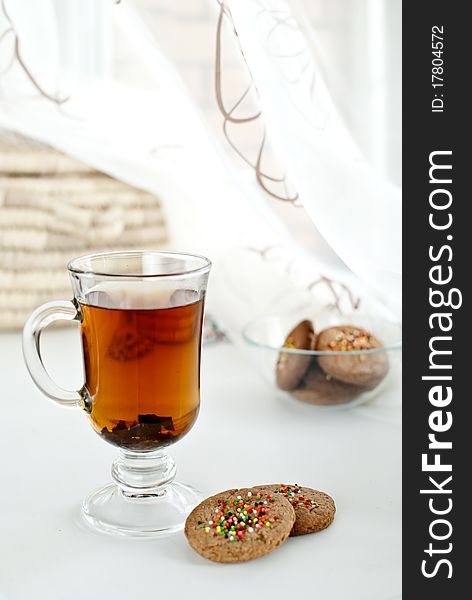 A cup of fragrant Ceylon tea with biscuits. A cup of fragrant Ceylon tea with biscuits