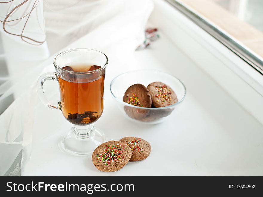 A cup of fragrant Ceylon tea with biscuits. A cup of fragrant Ceylon tea with biscuits