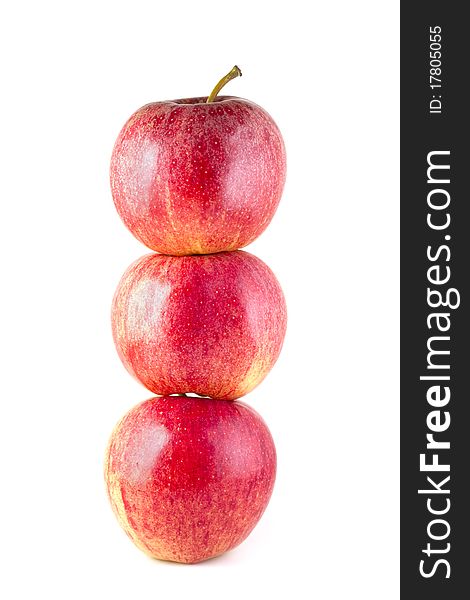 Stack of three red ripe apples