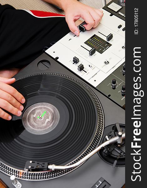 Hip-hop DJ Scratching The Vinyl Record