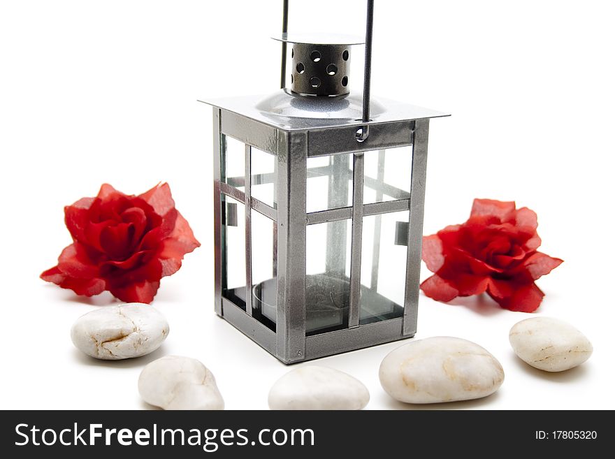 Wind light with red roses and stone