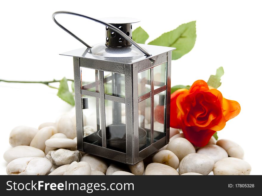 Wind light with red rose and stone