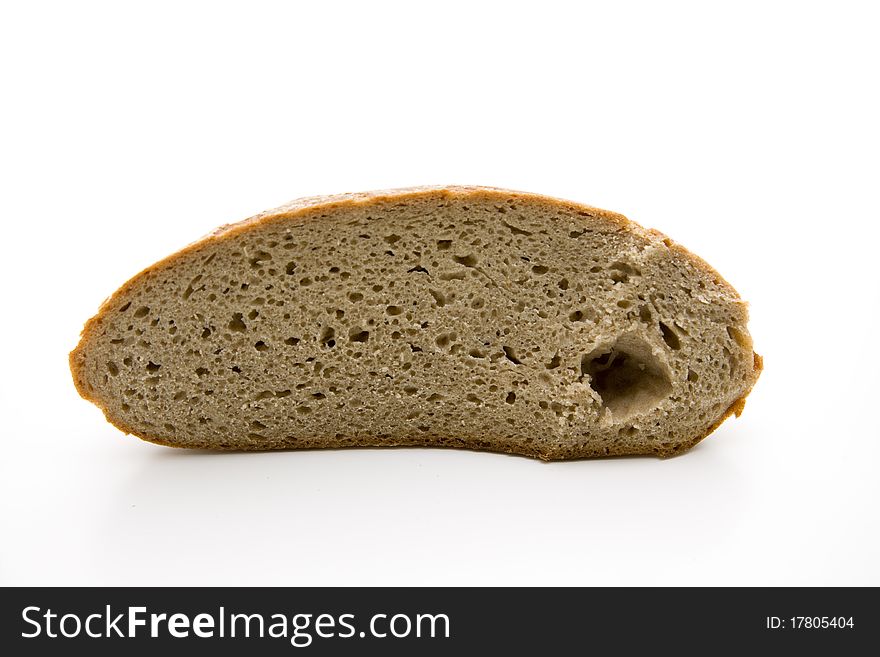 Fresh bread cut onto white background