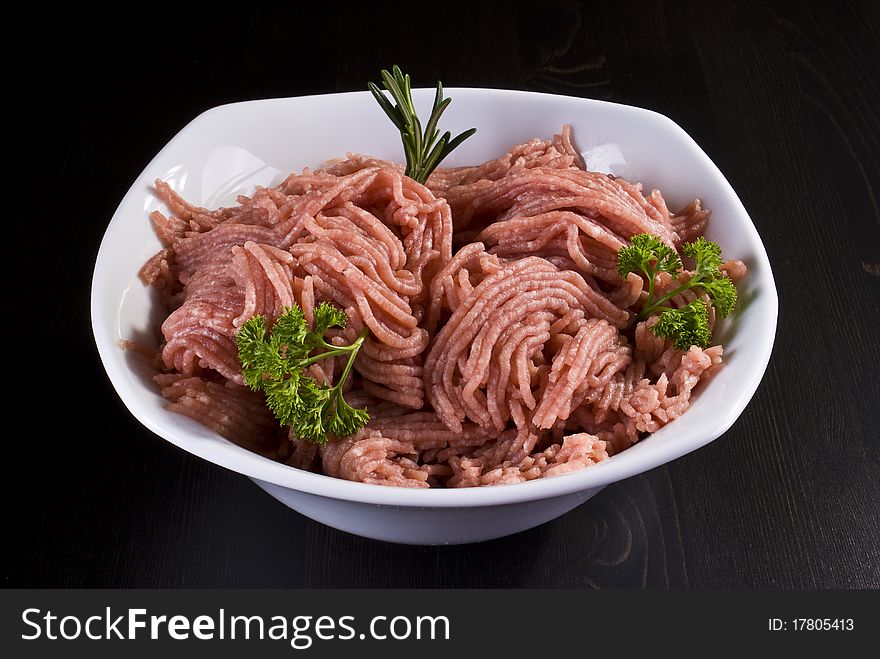 Bowl of raw minced pork with herbs. Bowl of raw minced pork with herbs