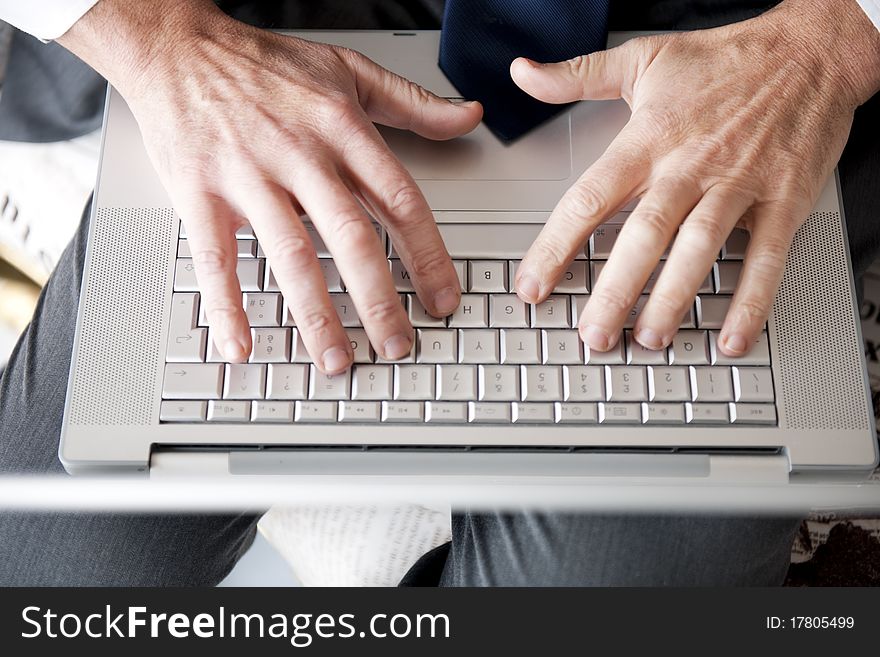 Close-up of Man's Hands On Computer Keyboard